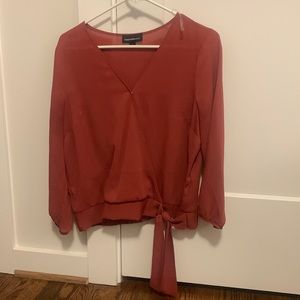 Rust colored false-wrap top.